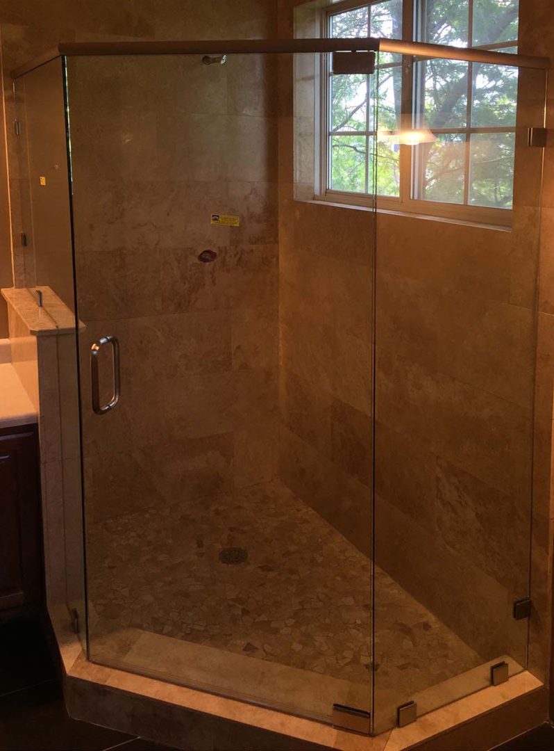 custom glass neo-angle shower enclosure with header bar with clamps