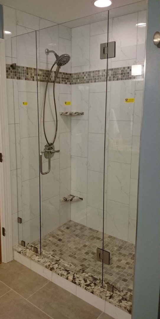 custom glass shower enclosure with clamps