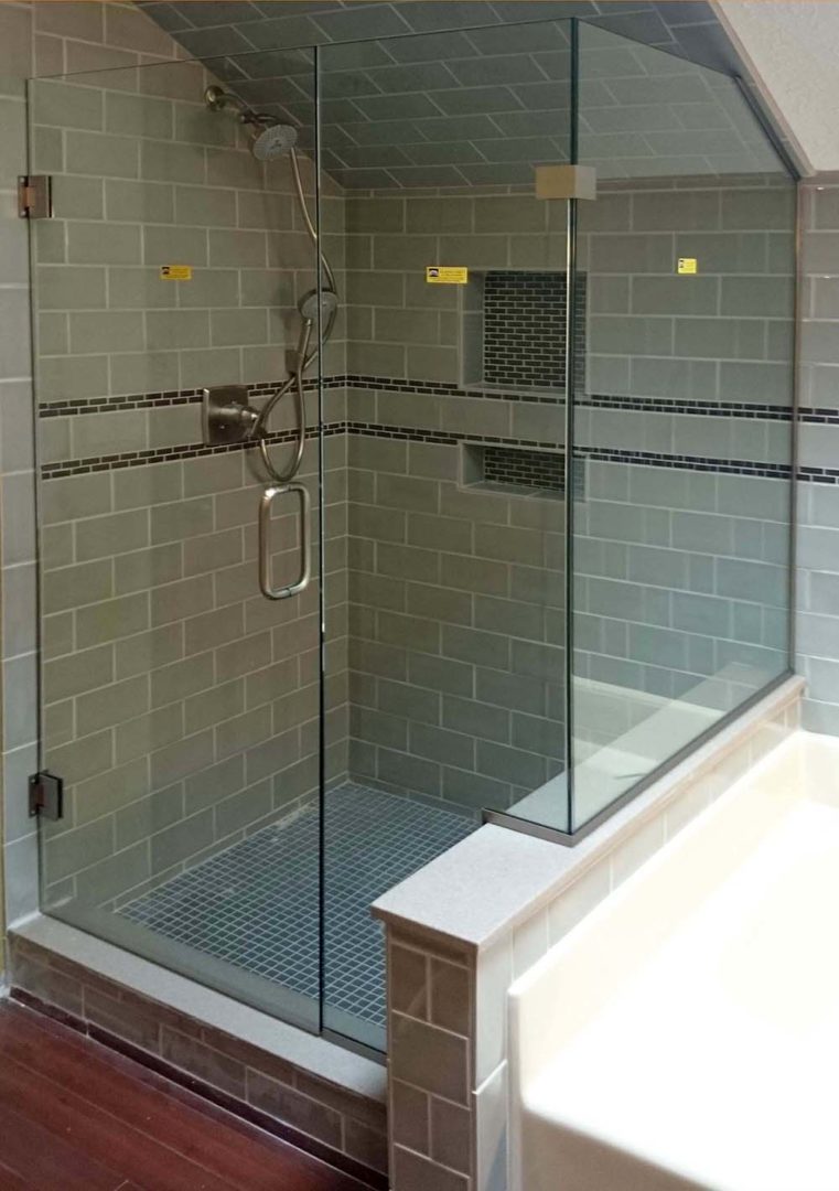 custom glass 90 degree shower enclosure on bench with u channel