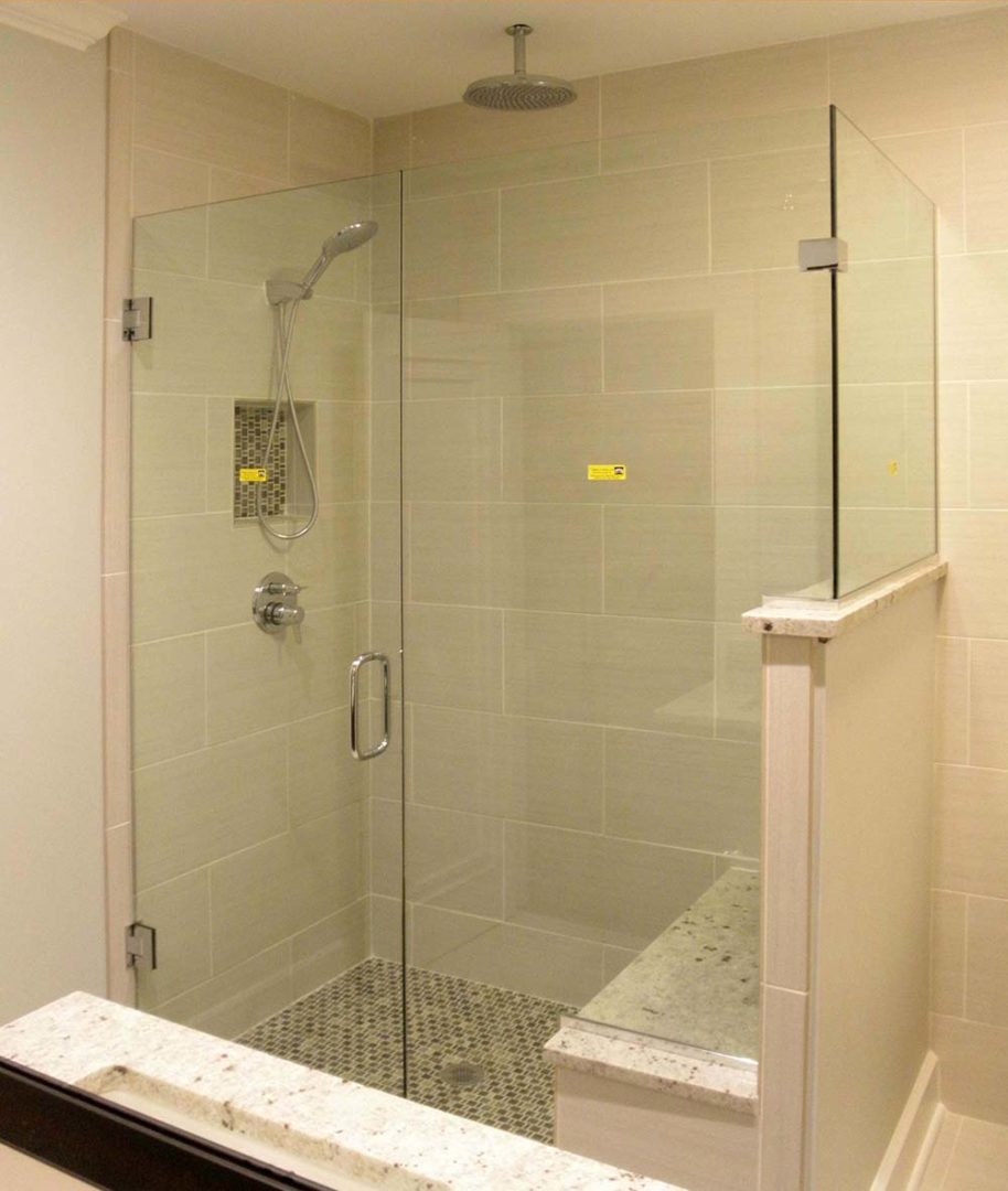 custom glass 90 degree shower enclosure on knee wall with u channel