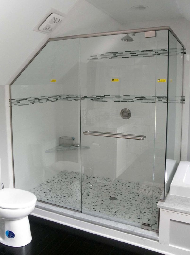 custom glass 90 degree shower enclosure on bench with header bar with u channel