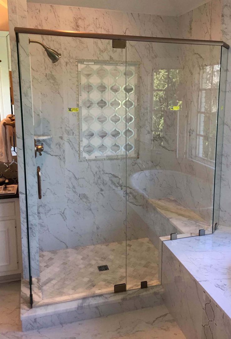 custom glass 90 degree shower enclosure on bench with header bar with clamps
